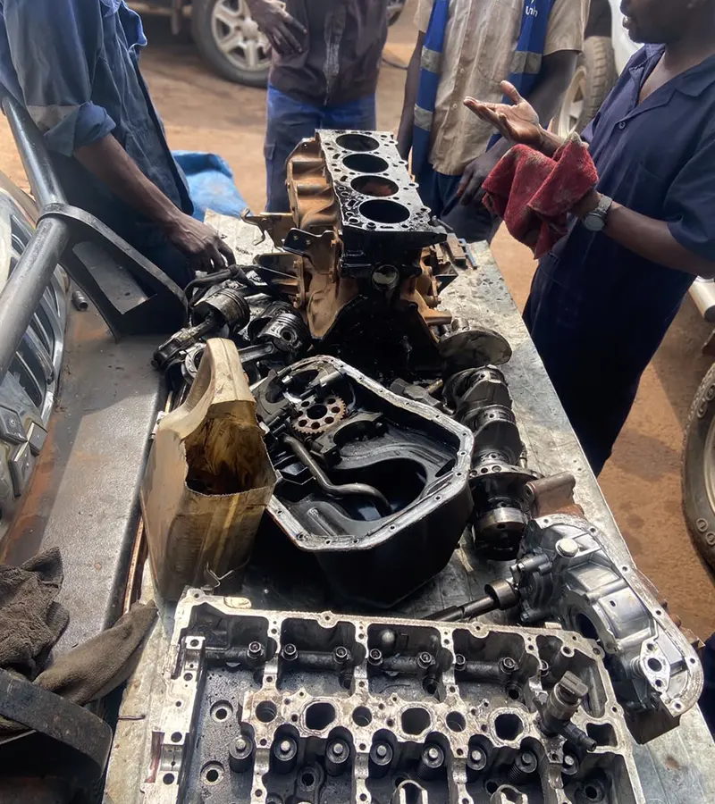 Automotive technician inspecting a vehicle